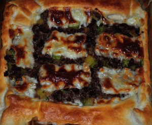 Torta salata di carne, zucchine e speck